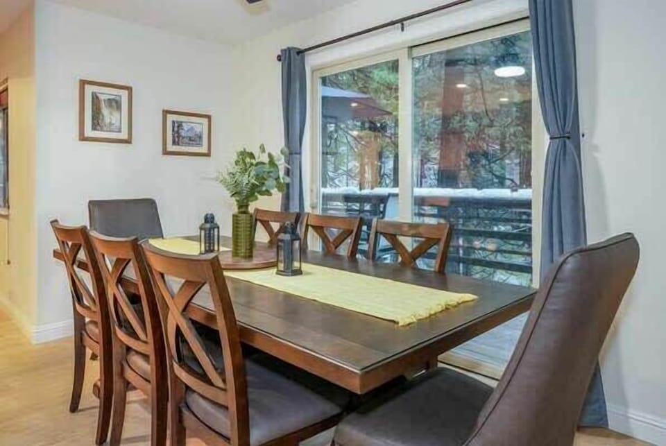 Large dining table. Additional bar seating is available. High chair for little ones is supplied. 