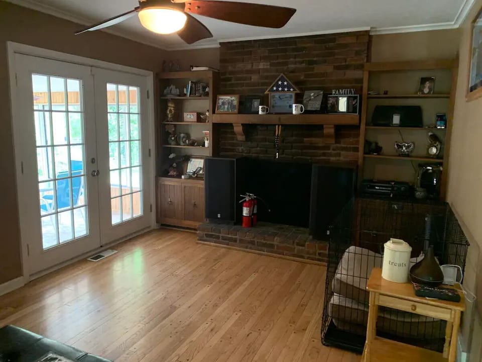 Sitting room: extra large dog crate and sofa bed (not a functional fireplace)