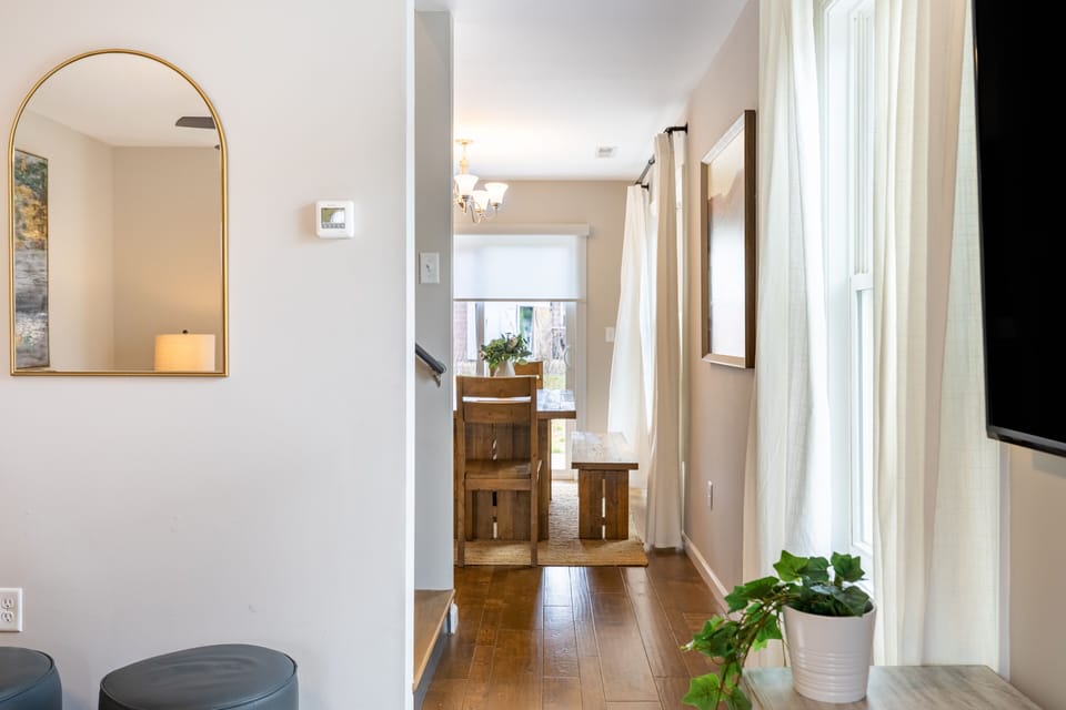 The kitchen and dining area are located down the hallway.