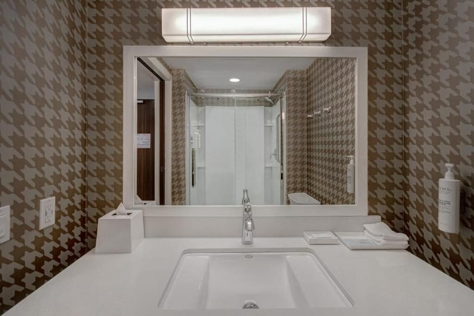 Refresh at the bright vanity with plenty of counter space.