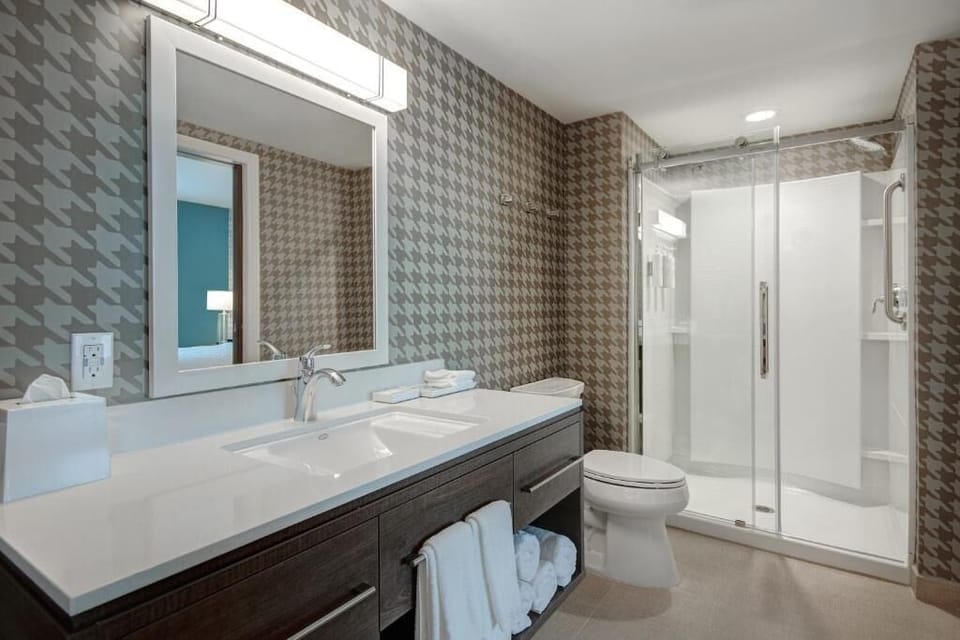 Rinse off in the sleek walk-in shower, spa-clean comfort.