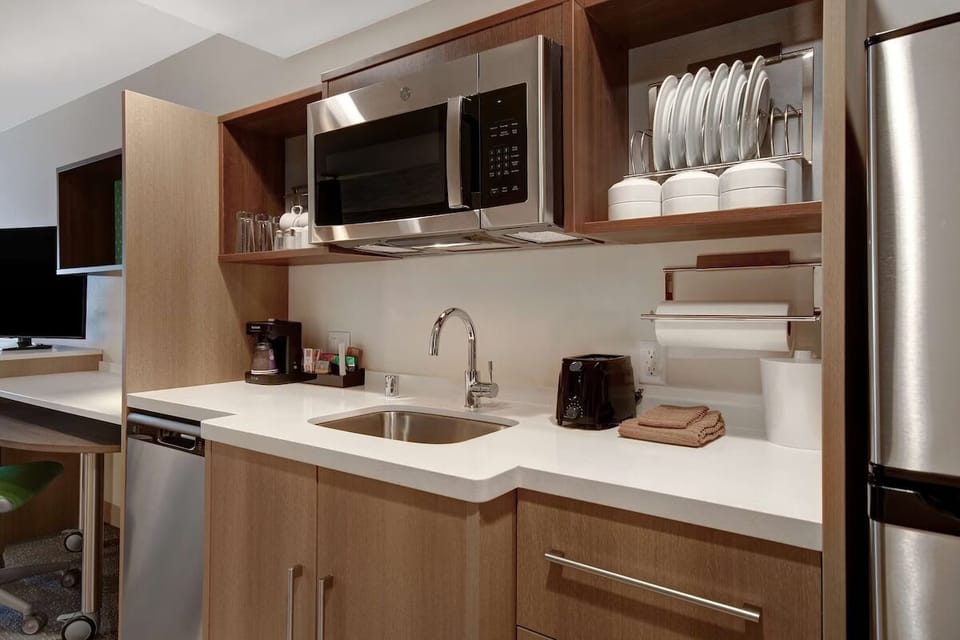 Start mornings with fresh coffee and an easy in-room kitchenette.
