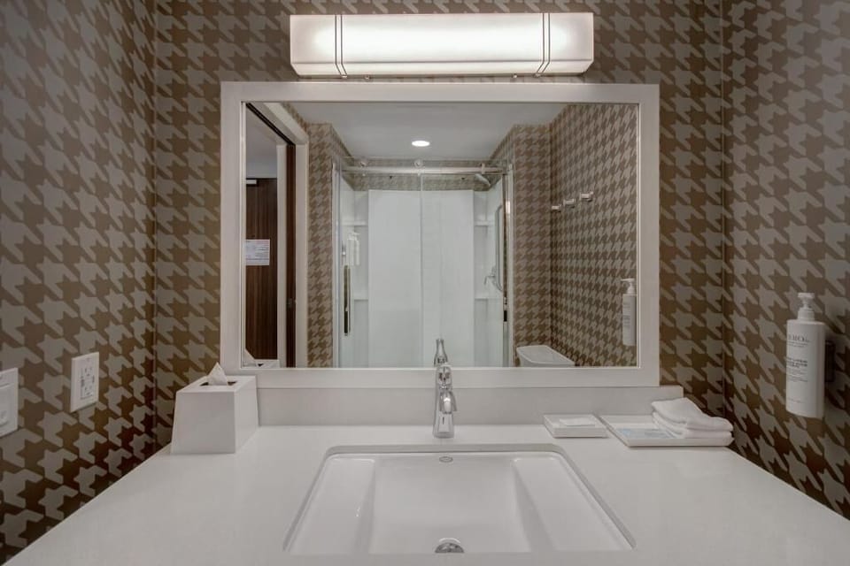 Refresh at the bright vanity with plenty of counter space.