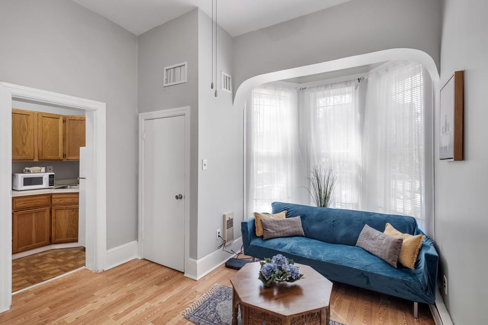Bright and Airy Space
Natural and soft lighting enhances the open feel of the room, complemented by elegant crown molding and neutral walls.