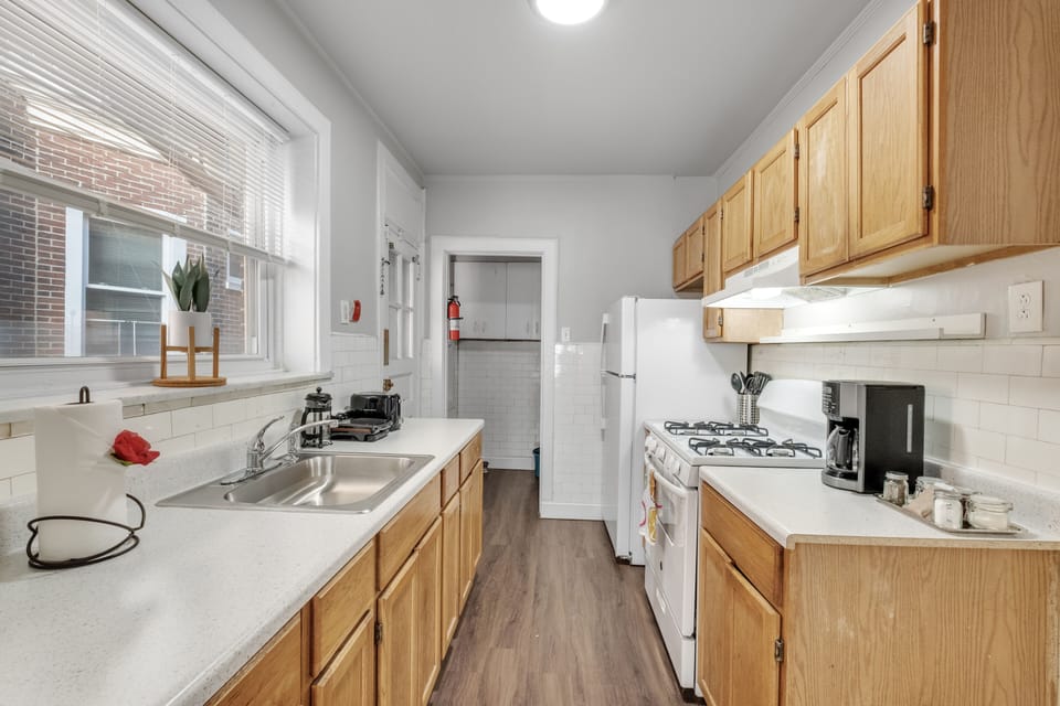 You have everything you need, stove, oven, fridge, freezer, coffee maker, toaster, dishware, flatware, cookware.  