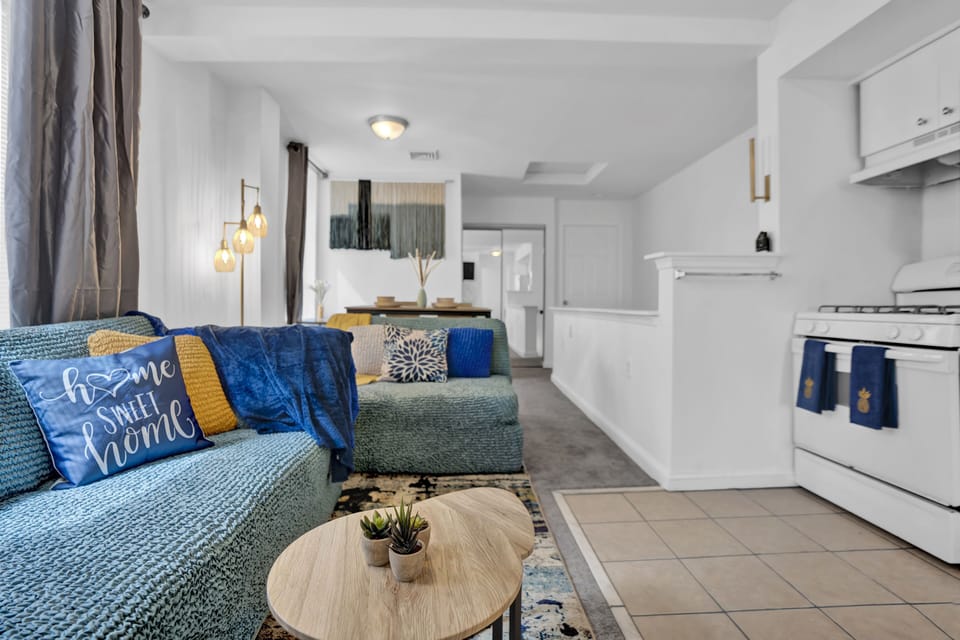 Smartly designed common space with a comfy couch, smart TV, and nice natural light.  All you have to do is log into your favorite streaming services and make it a TV night.