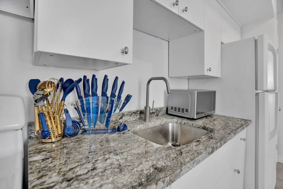 Microwave, toaster, coffee maker, and cooking essentials included