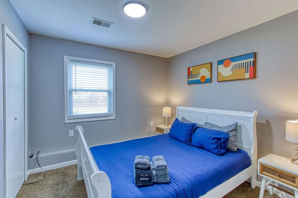 The bedroom’s serene ambiance invites you to relax, with a plush bed that promises a restful night's sleep.