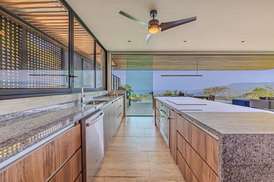 GOURMET KITCHEN OPENS TO THE OUTDOORS