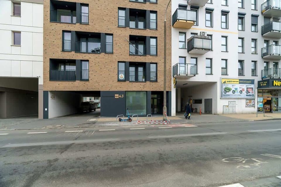 The neighbourhood and the building in which the apartment is located. 