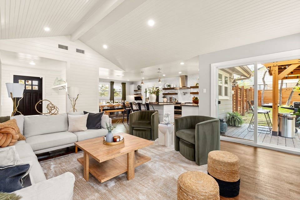 Spacious open-concept layout connecting foyer, living room, dining, and kitchen.