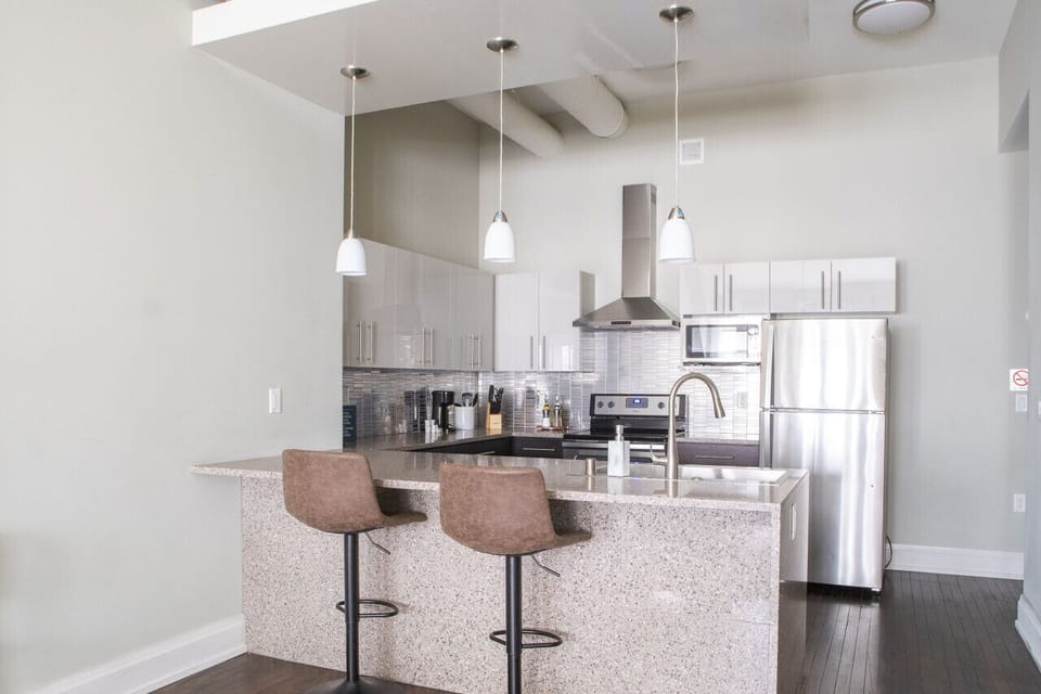 Full kitchen with island and bar stool seating
