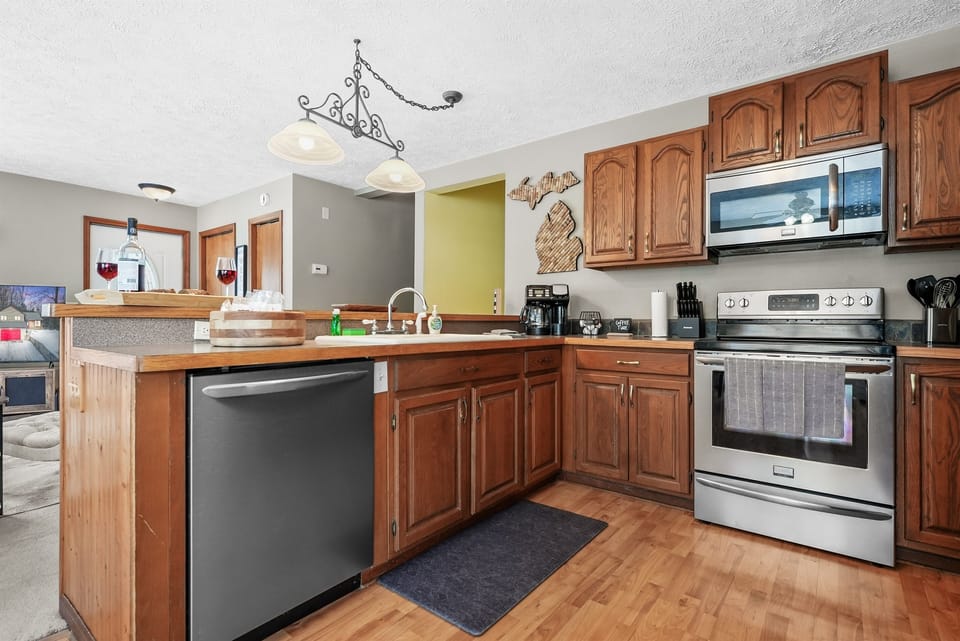 Kitchen: Create culinary masterpieces in this bright space with modern amenities and rustic flair!