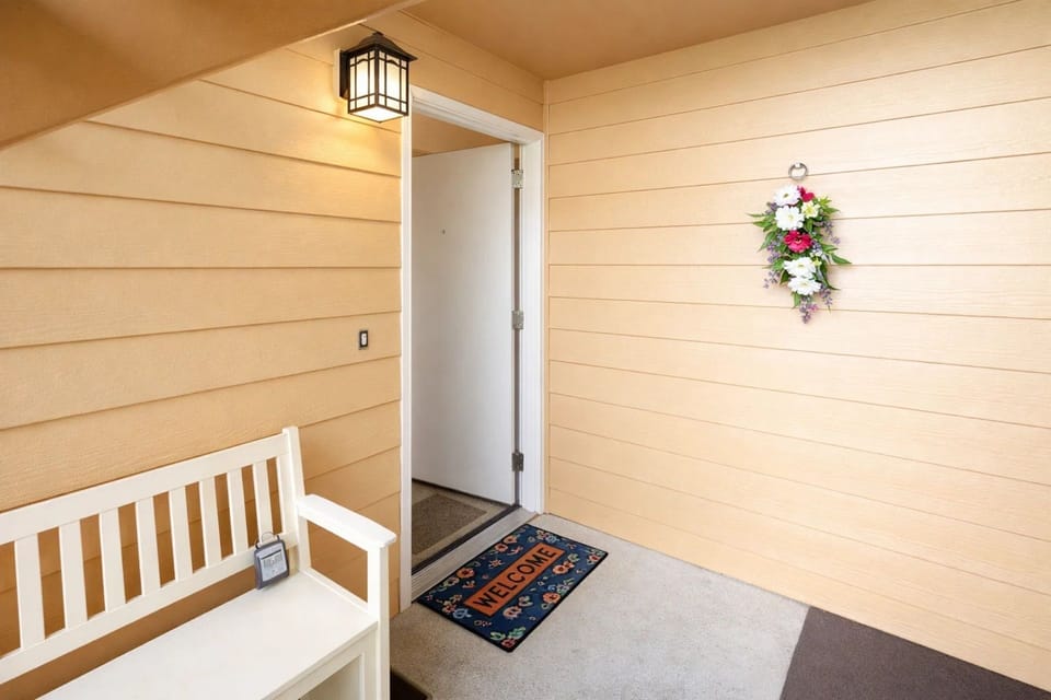 Entryway Charm: Bright and inviting entrance with a welcoming bench for peaceful moments!