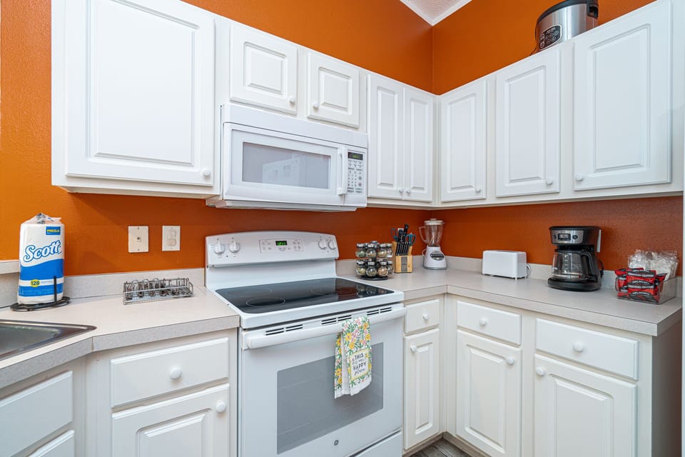 Kitchen: Whip up culinary delights in this vibrant kitchen, complete with modern appliances and a fun vibe!