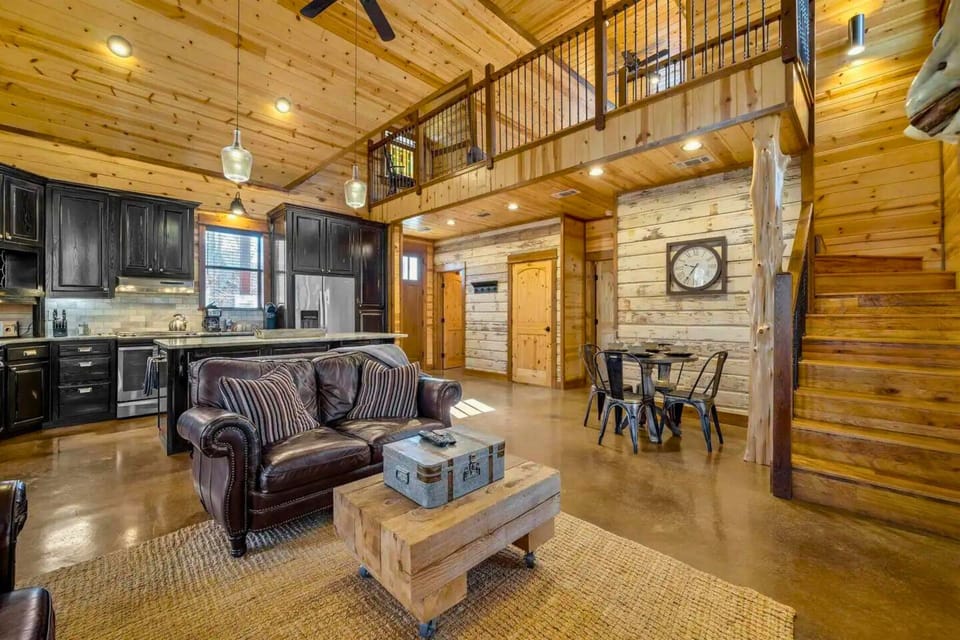 Cozy up with a book or a movie in our living room, where comfort meets rustic elegance.