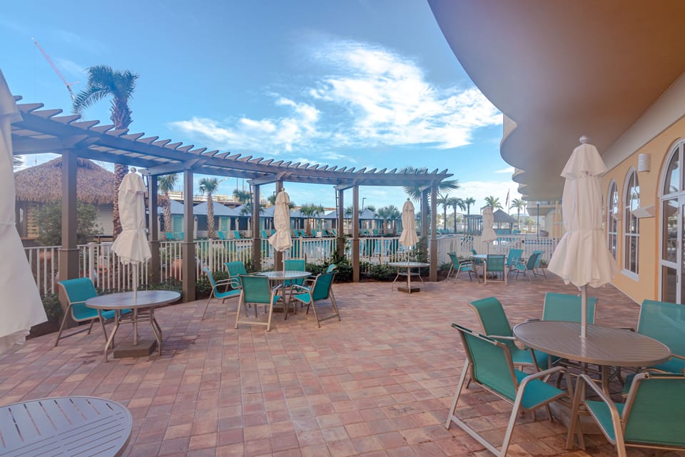 Comfortable table and chairs on pool deck