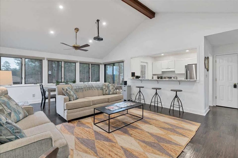Inviting and open living space with full screen projector