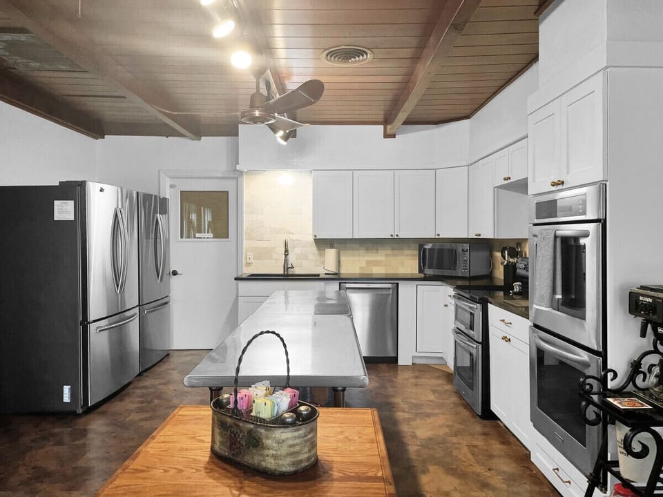 Modern elegance meets functionality in our spacious, fully stocked kitchen remodel.