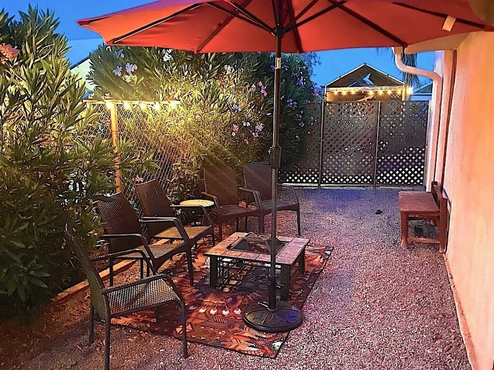 Santa Fe private gated garden with firepit, patio table & chairs, and habaci