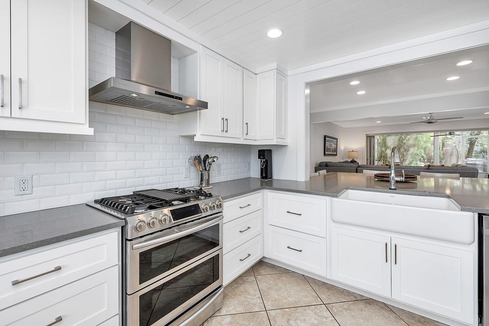 Large kitchen open to dining area with huge island for dining and playing games.