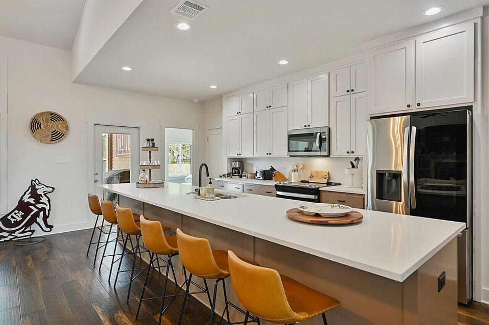The house embodies A&M spirit with tasteful decor and touches, creating a spirited atmosphere throughout.