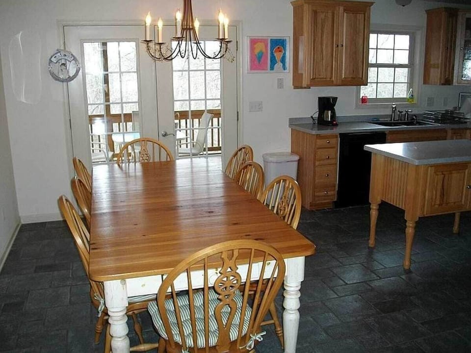 The screened porch is off the kitchen.