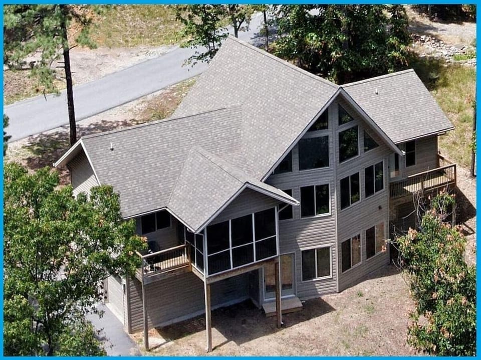 An aerial view of the house on a sunny Spring day.