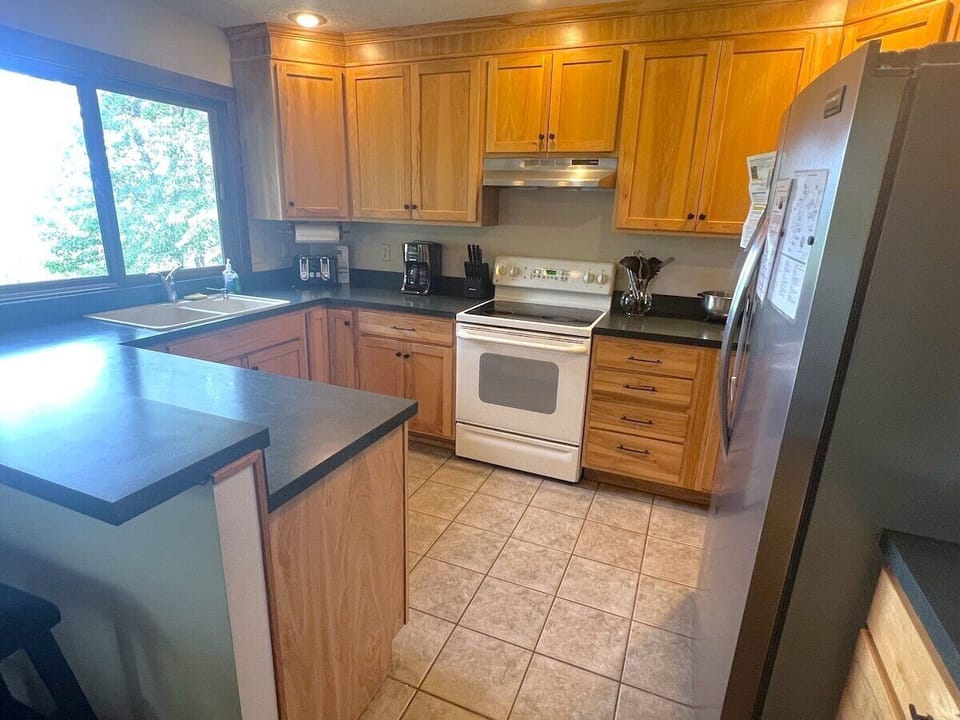 Second view of the kitchen that includes a glimpse of the outside!