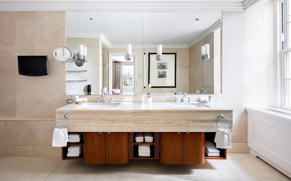 Refresh at a double vanity with bright, spa-like lighting.