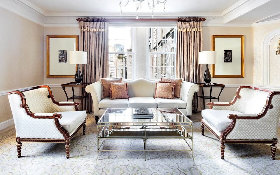 Gather for cocktails in an elegant lounge with city light.
