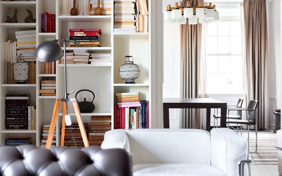 Sip coffee surrounded by curated books and soft daylight.