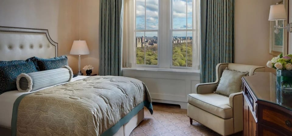 Wake up to sweeping park views from a plush bed