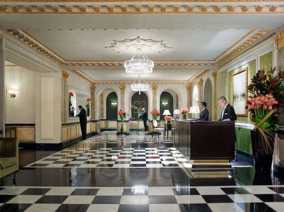 Step into a grand lobby that feels timeless and welcoming.