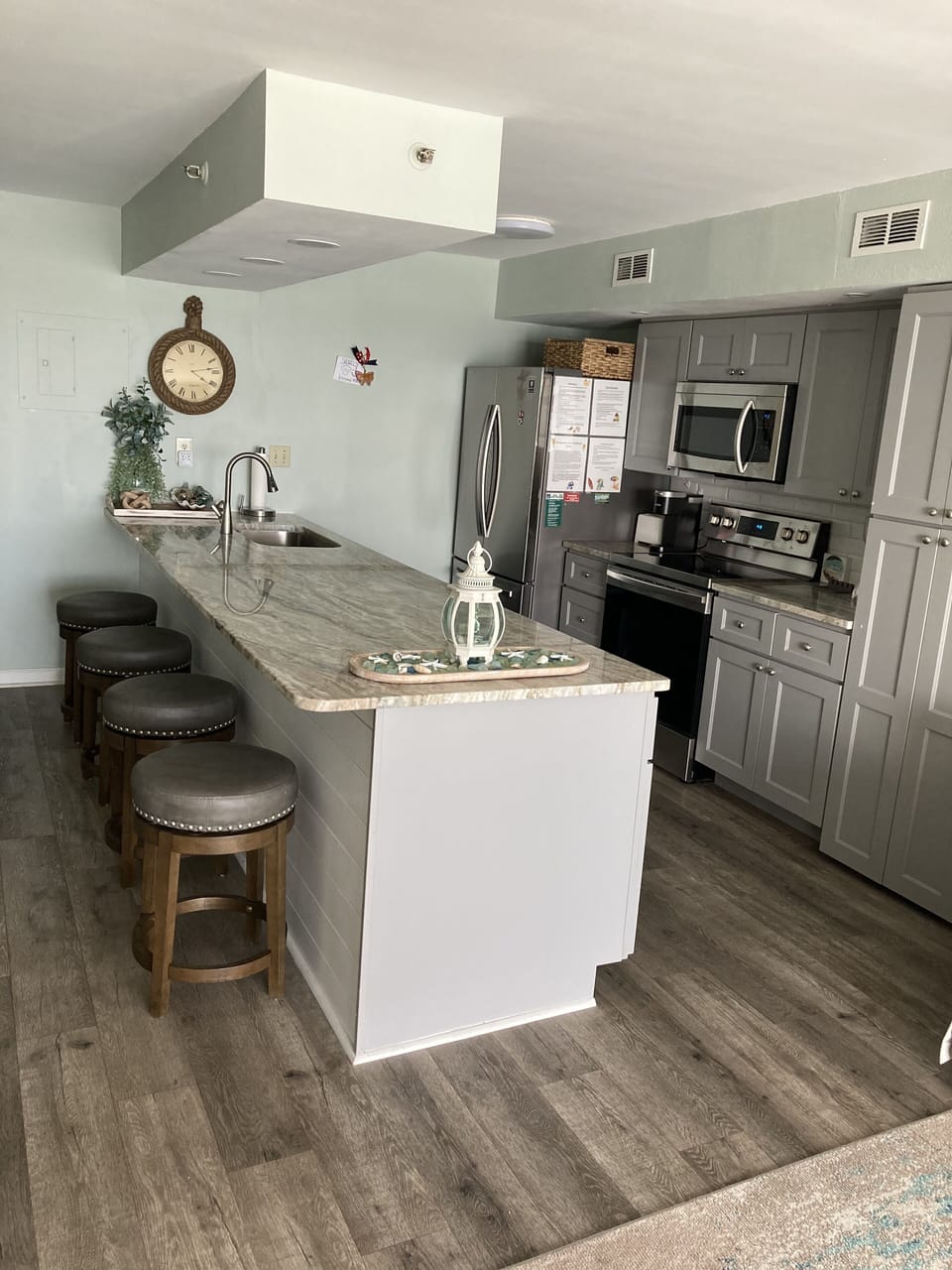 Extra long bar for seating and food prep. Four comfortable stools.