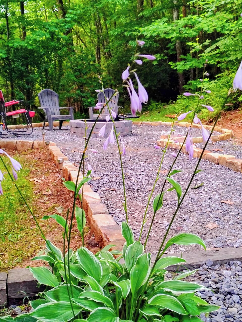 Unwind by your private fire pit nestled in the peaceful woods.