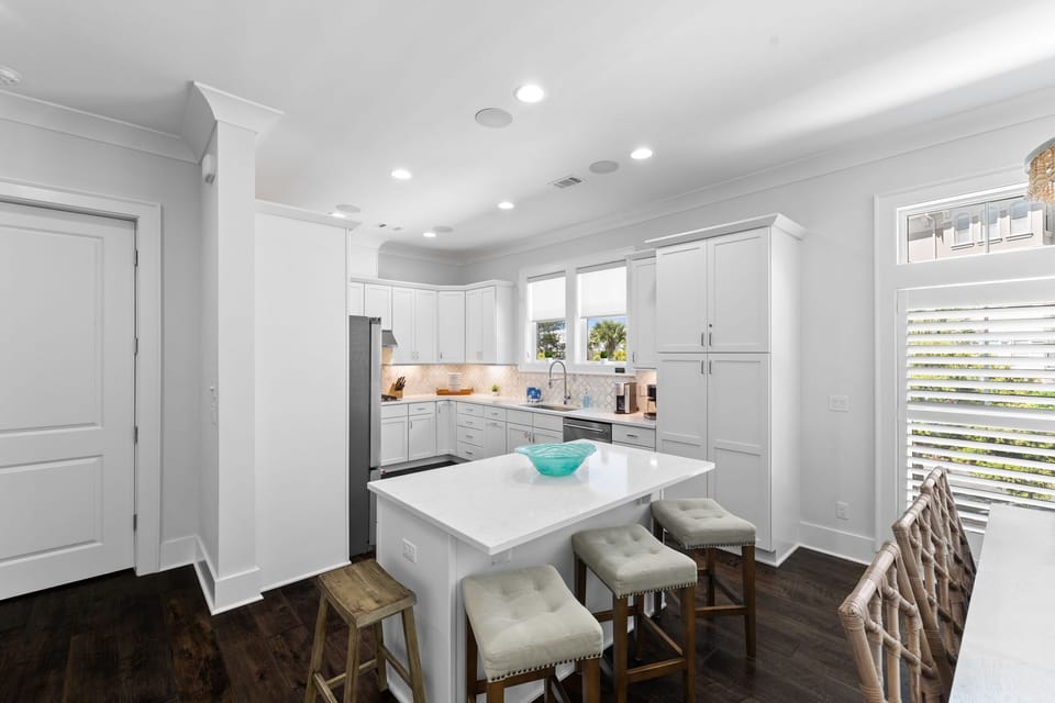 The kitchen island provides additional seating.
