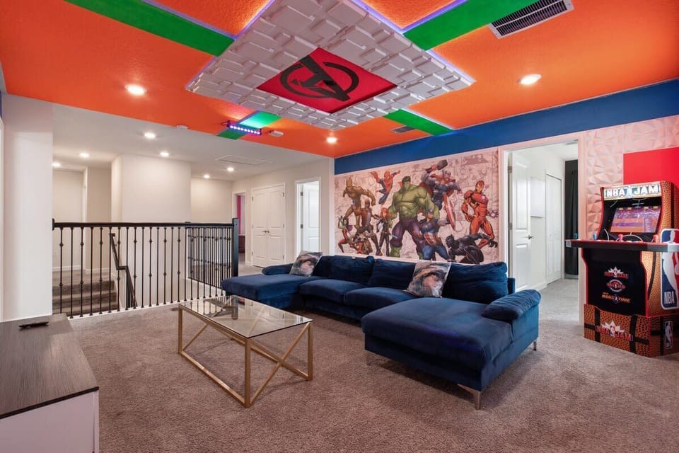 Game On, Upstairs: Our Loft Is a Playground for All Ages, Featuring an Array of Arcade Games, a Cozy Movie Theater, and Chic Interior Design Touches That Take Fun to New Heights! 