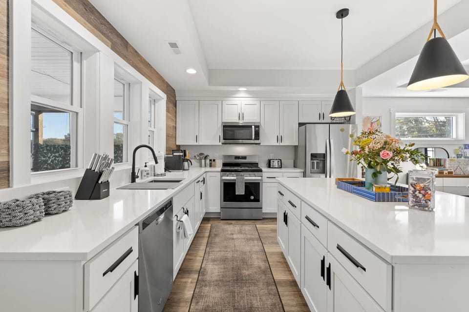 Open concept kitchen w/tons of amenities, and a large island for three.