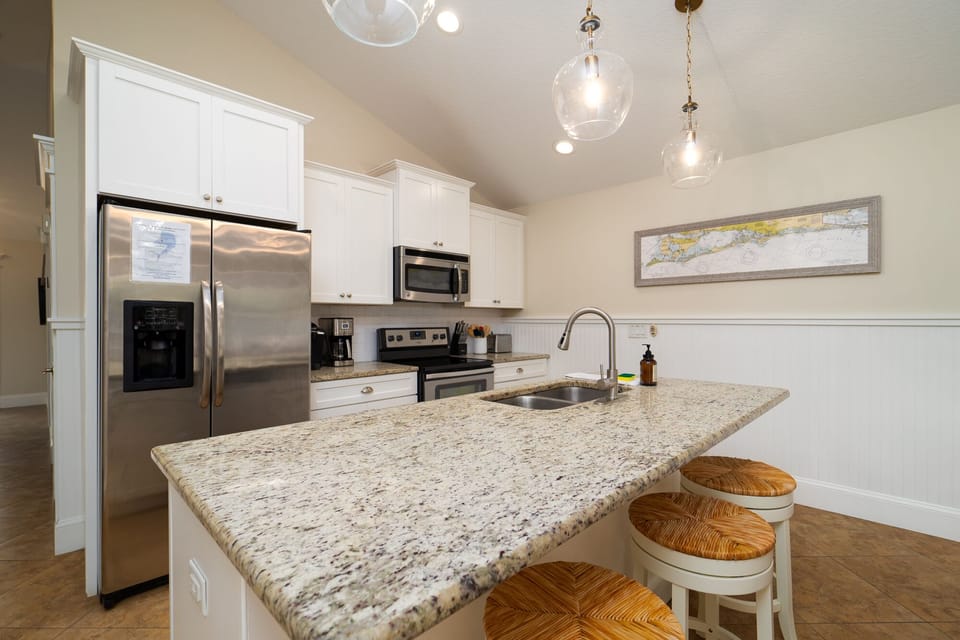 This spacious counter with 3 swivel barstools makes for a fun way to prep meals and still be a part of the fun!