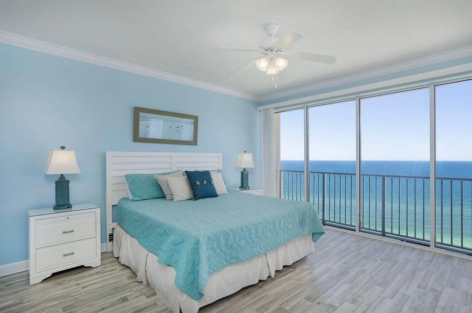 Master bedroom with king bed and ensuite bathroom + balcony access