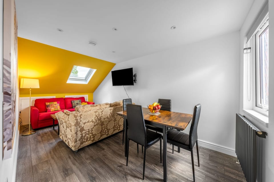 Living room with 2 sofa beds, Smart TV and dinning table.