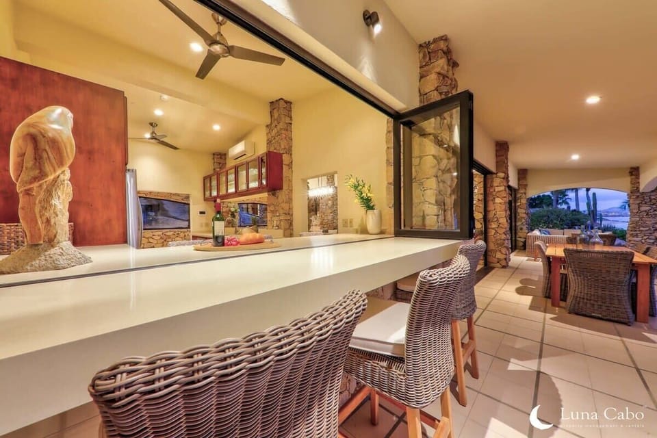 A dining bar with sliding glass windows to extend the space