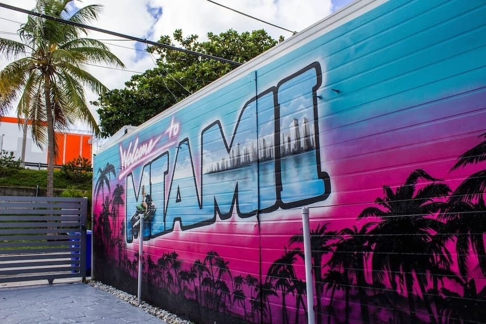 Our dazzling "Welcome to Miami" mural bursts with Miami Vice hues. A vibrant scene unfolds— a girl on a jetski skimming turquoise waves against the iconic Miami skyline. A vivid tribute capturing the city's energy and coastal allure.