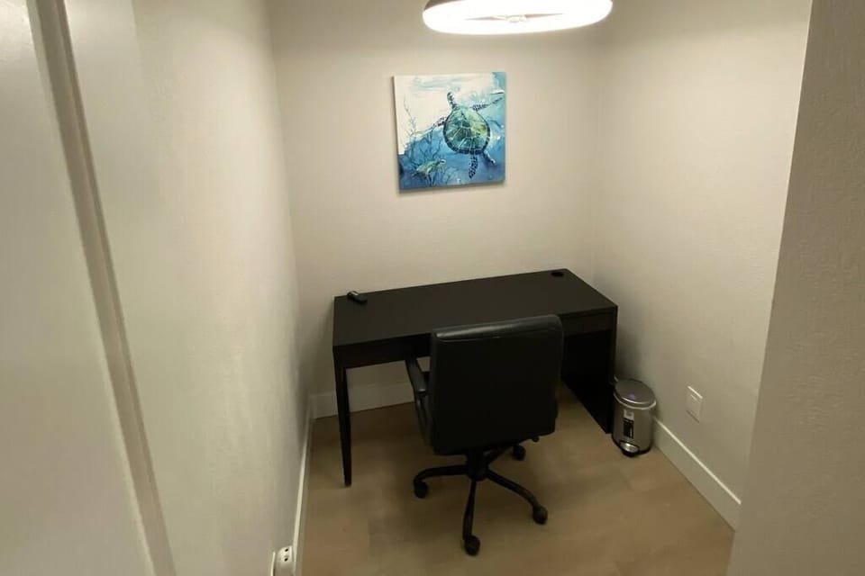 Welcome to your quiet retreat! Our cozy office/study area boasts a spacious desk, comfortable chair, and ample outlets for all your devices. With lightning-fast WiFi, it's the perfect spot to focus and unleash your productivity