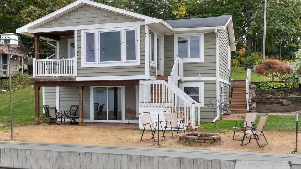 Sandy lower level walkout area, patio table and firepit