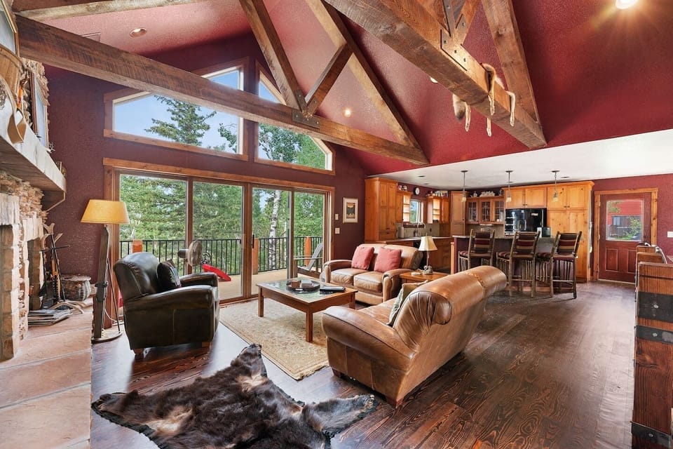 The wall of glass brings the beauty of the Black Hills into the cabin.