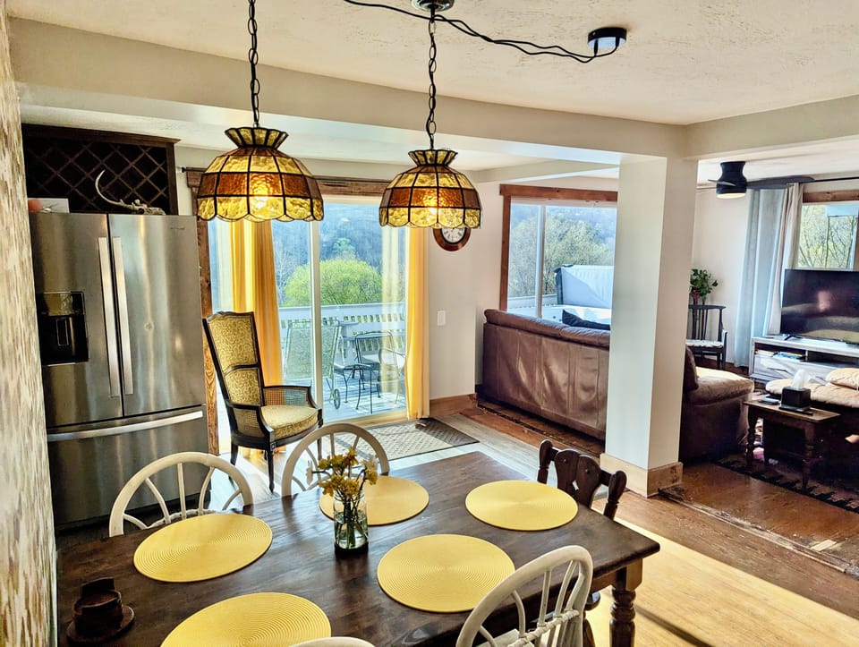 Dining area has wonderful natural light and more gorgeous views out sliding door