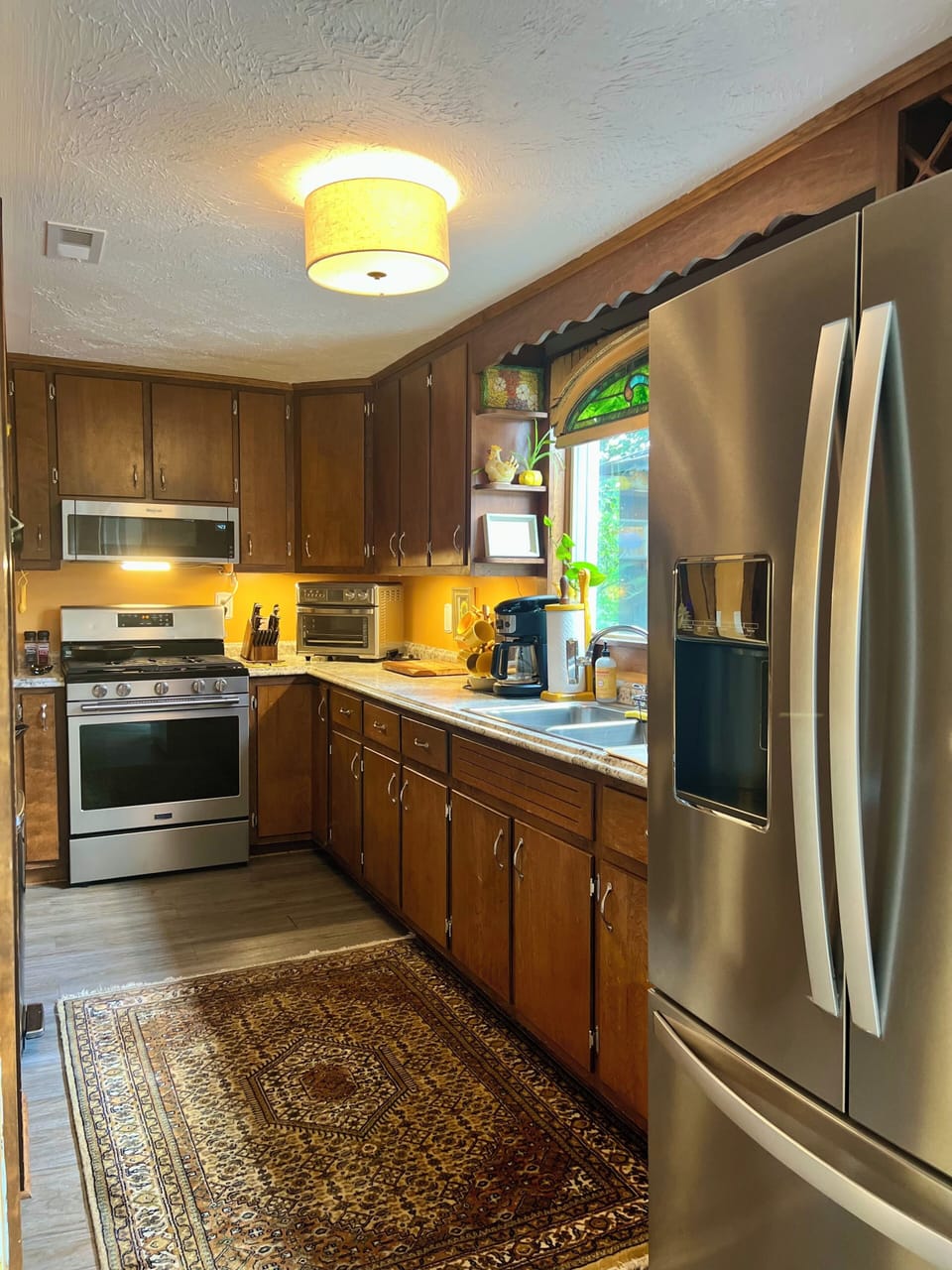 Galley kitchen with all appliances, including dishwasher