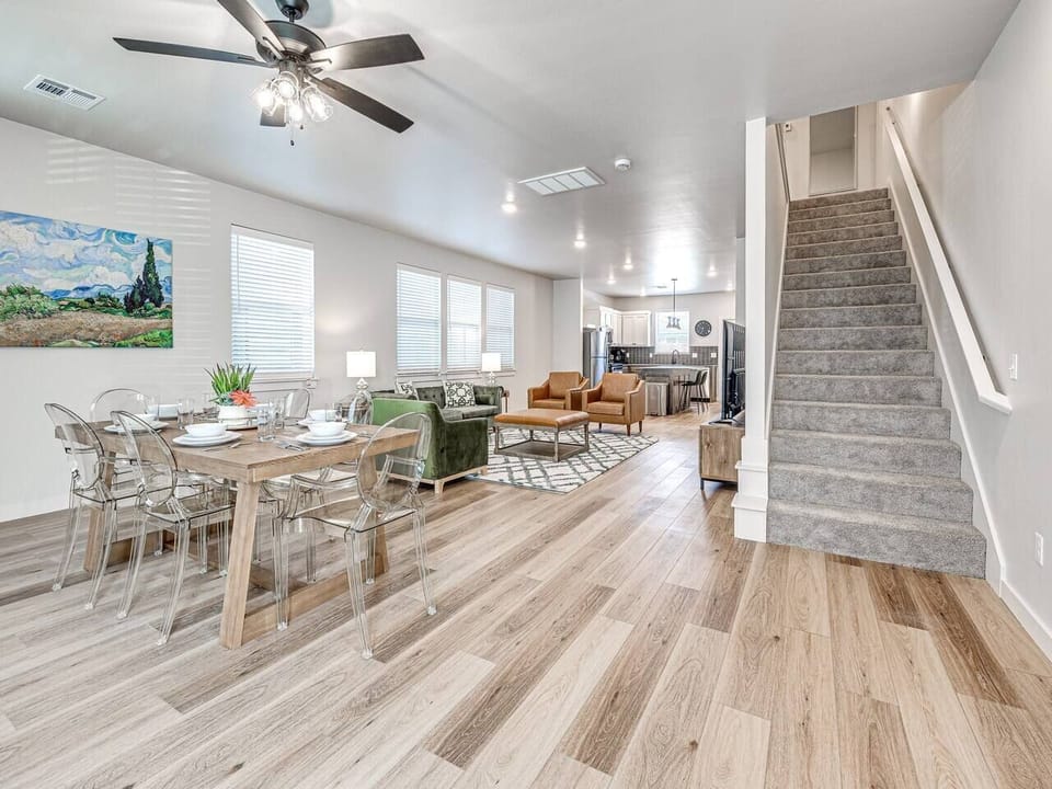 “Step into a realm of chic comfort with our spacious living area, where modern decor meets homely warmth, perfect for creating unforgettable moments.”